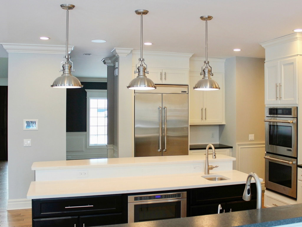 Custom Transitional, Open Kitchen with White Quartz Countertops and Contemporary Pendant Lighting Built Exclusively by Morgan Homes of Western New York, Inc.