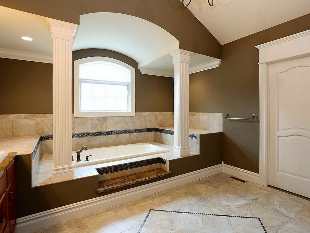 Traditional Master Bathroom with Vaulted Ceiling, Floor-to-Ceiling Tiled Shower, and Custom Cabinetry Built Exclusively by Morgan Homes of Western New York, Inc.