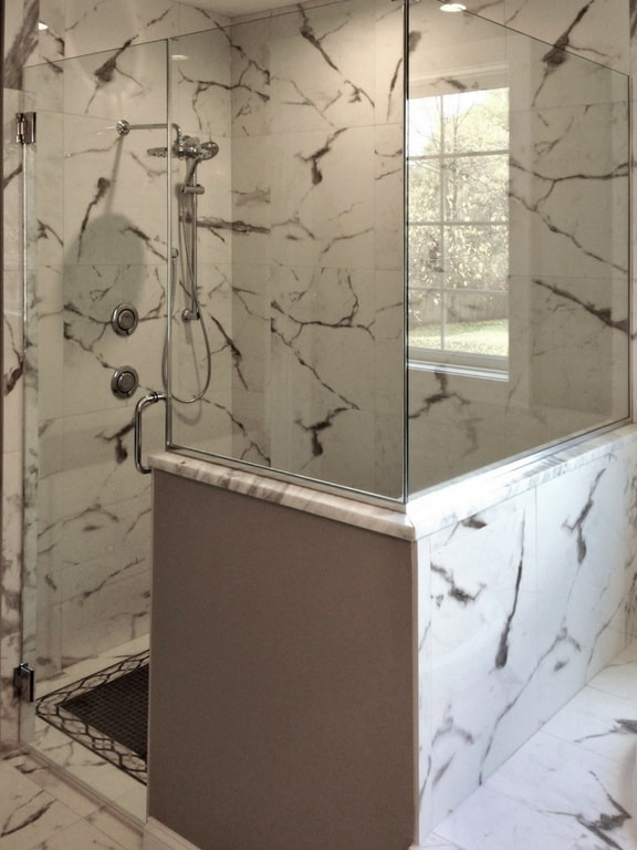 Master Bathroom Walk-In Shower with Floor-to-Ceiling Marble and Accent Mosaic Floor Built Exclusively by Morgan Homes of Western New York, Inc.
