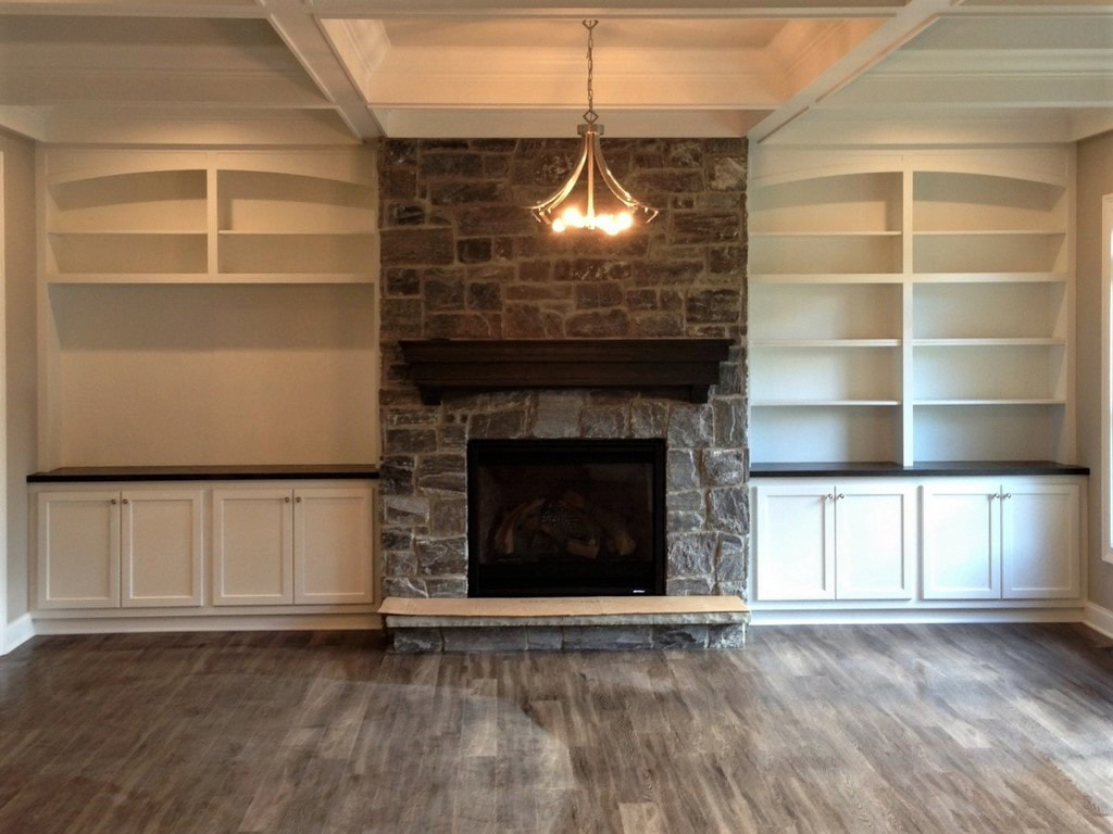 Transitional Drop Ceiling Great Room with Large Windows and Custom Fireplace-Housing Bookcases Built Exclusively by Morgan Homes of Western New York, Inc.